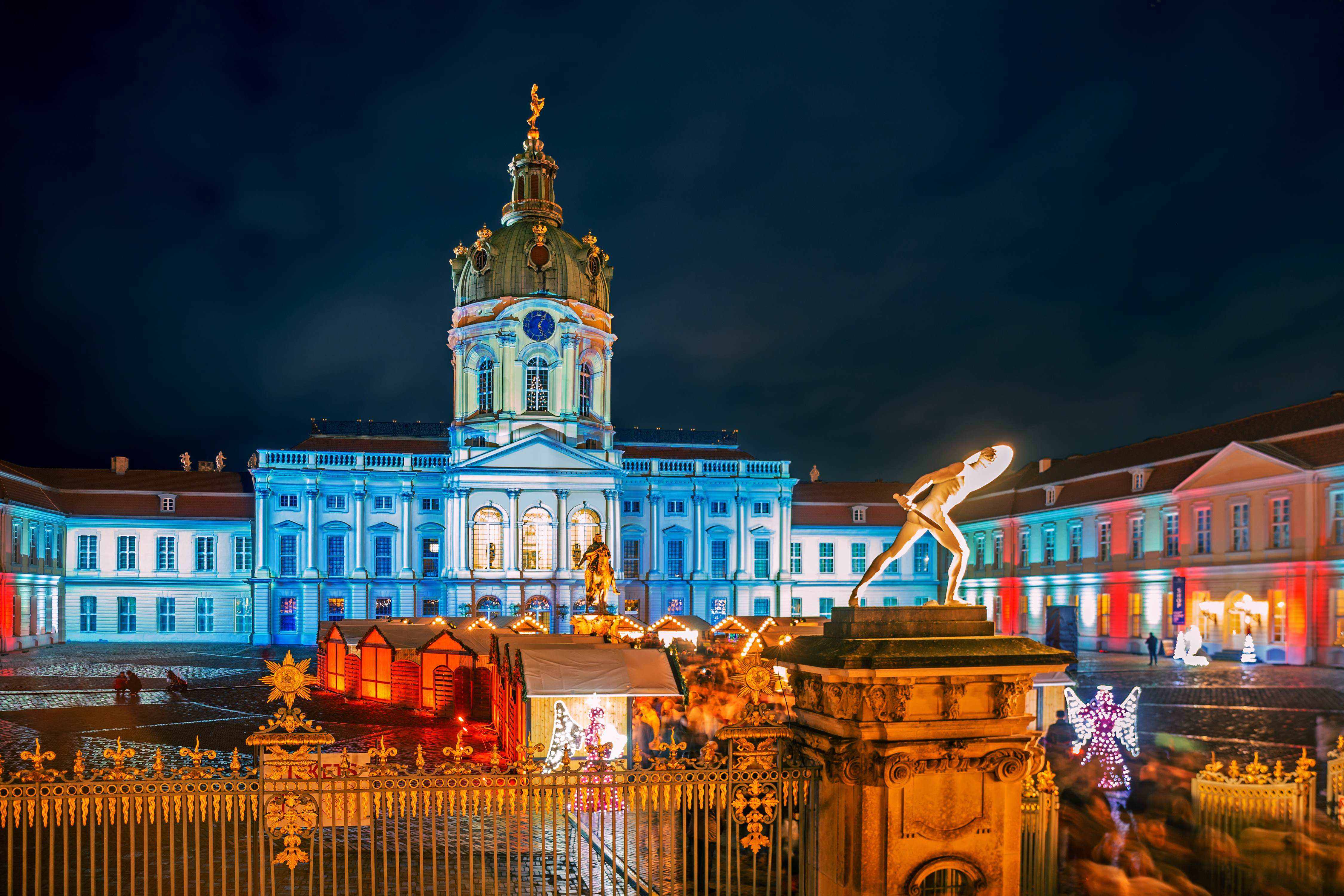 Christmas market of Charlottenburg Palace at night in Berlin